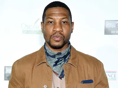 Jonathan Majors is an American actor who gained widespread recognition for his roles in films and television shows. However, in 2023, he faced significant legal and professional challenges due to allegations of domestic violence and assault. Here’s a detailed overview of what happened: Background Jonathan Majors rose to fame for his roles in projects like: Lovecraft Country (HBO series) The Last Black Man in San Francisco (film) Devotion (film) Creed III (film) Ant-Man and the Wasp: Quantumania (Marvel Cinematic Universe) He was widely regarded as one of Hollywood's rising stars, particularly after being cast as Kang the Conqueror, a major villain in the Marvel Cinematic Universe (MCU). The Allegations and Arrest In March 2023, Jonathan Majors was arrested in New York City following allegations of domestic violence. The incident reportedly involved a dispute with a woman, who claimed Majors assaulted her during an argument. The New York Police Department (NYPD) confirmed the arrest, and Majors was charged with: Assault Harassment Strangulation (a felony charge) Majors’ legal team denied the allegations, stating that he was innocent and that he was, in fact, the victim in the situation. They claimed there was evidence, including video footage and witness statements, that would exonerate him. Impact on His Career The allegations had immediate repercussions on Majors’ career: Dropped Projects: Several brands and organizations distanced themselves from Majors. The U.S. Army pulled advertisements featuring Majors, and other projects he was associated with were put on hold. Marvel’s Response: Marvel Studios, which had cast Majors as Kang the Conqueror, remained silent initially. However, rumors circulated about potential recasting or rewriting of future MCU projects involving his character. Public Backlash: The allegations sparked widespread discussion about accountability in Hollywood and the handling of domestic violence cases involving public figures. Legal Proceedings The case went to court, and Majors’ legal team worked to defend him against the charges. They presented evidence, including text messages and medical records, to support their claim that Majors was not the aggressor. The case drew significant media attention, with many outlets covering the developments closely. Outcome As of my knowledge cutoff in October 2023, the legal proceedings were ongoing, and no final verdict had been reached. The outcome of the case will likely have a significant impact on Majors’ career and reputation moving forward. Conclusion Jonathan Majors’ situation serves as a reminder of the complexities surrounding legal cases involving public figures. While he was once celebrated for his talent and rising stardom, the allegations have cast a shadow over his career. The final resolution of the case will determine his future in the entertainment industry.